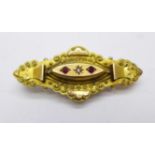 A 9ct gold, red stone and diamond brooch, 3.