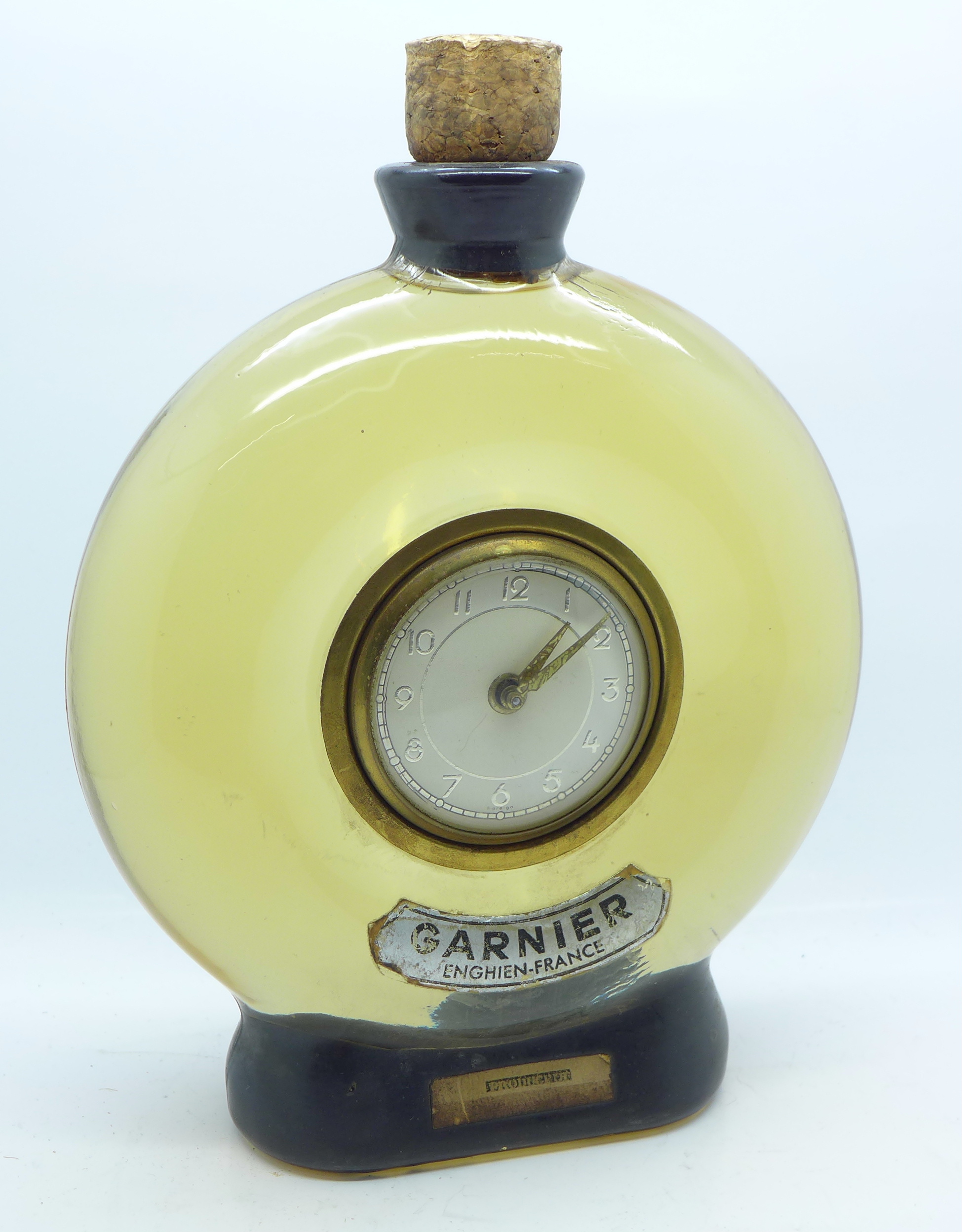 A novelty decanter clock