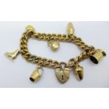 Seven 9ct gold charms on a plated bracelet