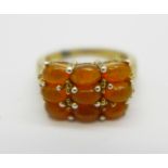 A silver gilt and fire opal ring,