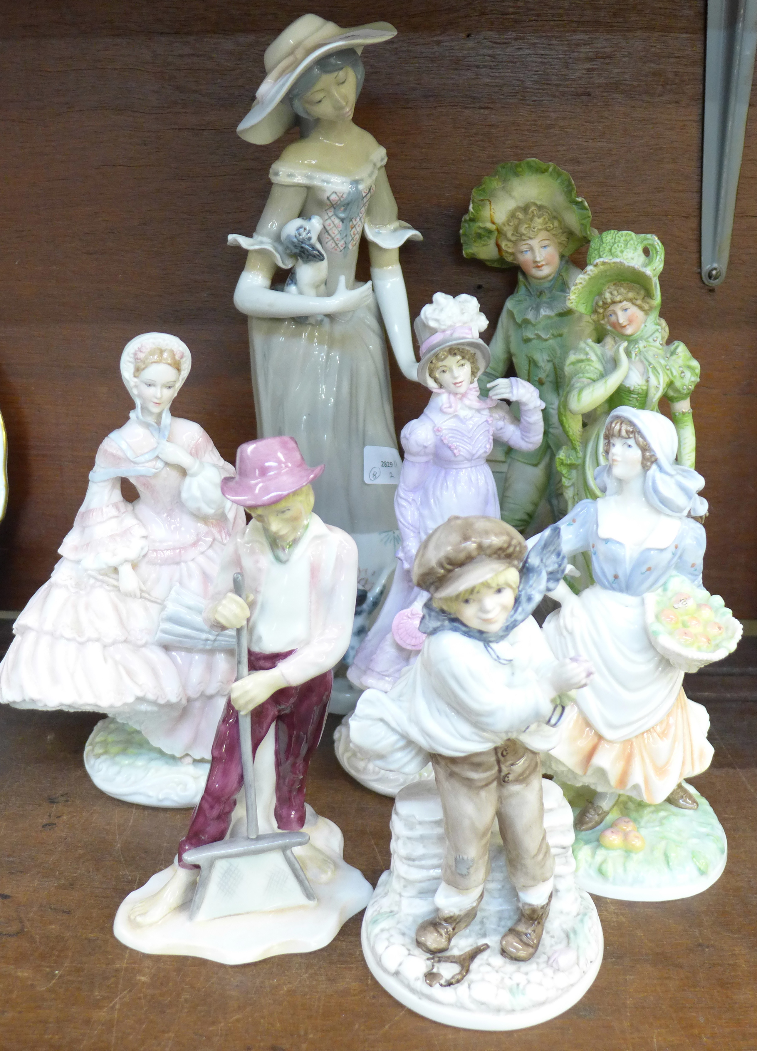 Three Royal Worcester figures, a Coalport figure and four other figures,