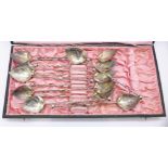 A set of twelve Chinese white metal spoons,