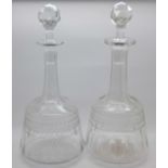 A pair of etched glass decanters