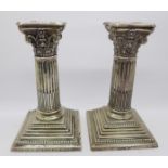 A pair of silver candlesticks by Walker & Hall, with fox hunting inscription dated 1905,