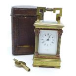 A miniature French brass carriage clock with four Corinthian columns, in brown Morocco leather case,
