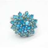 A 9ct white gold neon apatite cluster ring, 4g,