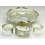 A silver bon bon dish, a/f and three silver napkin rings,