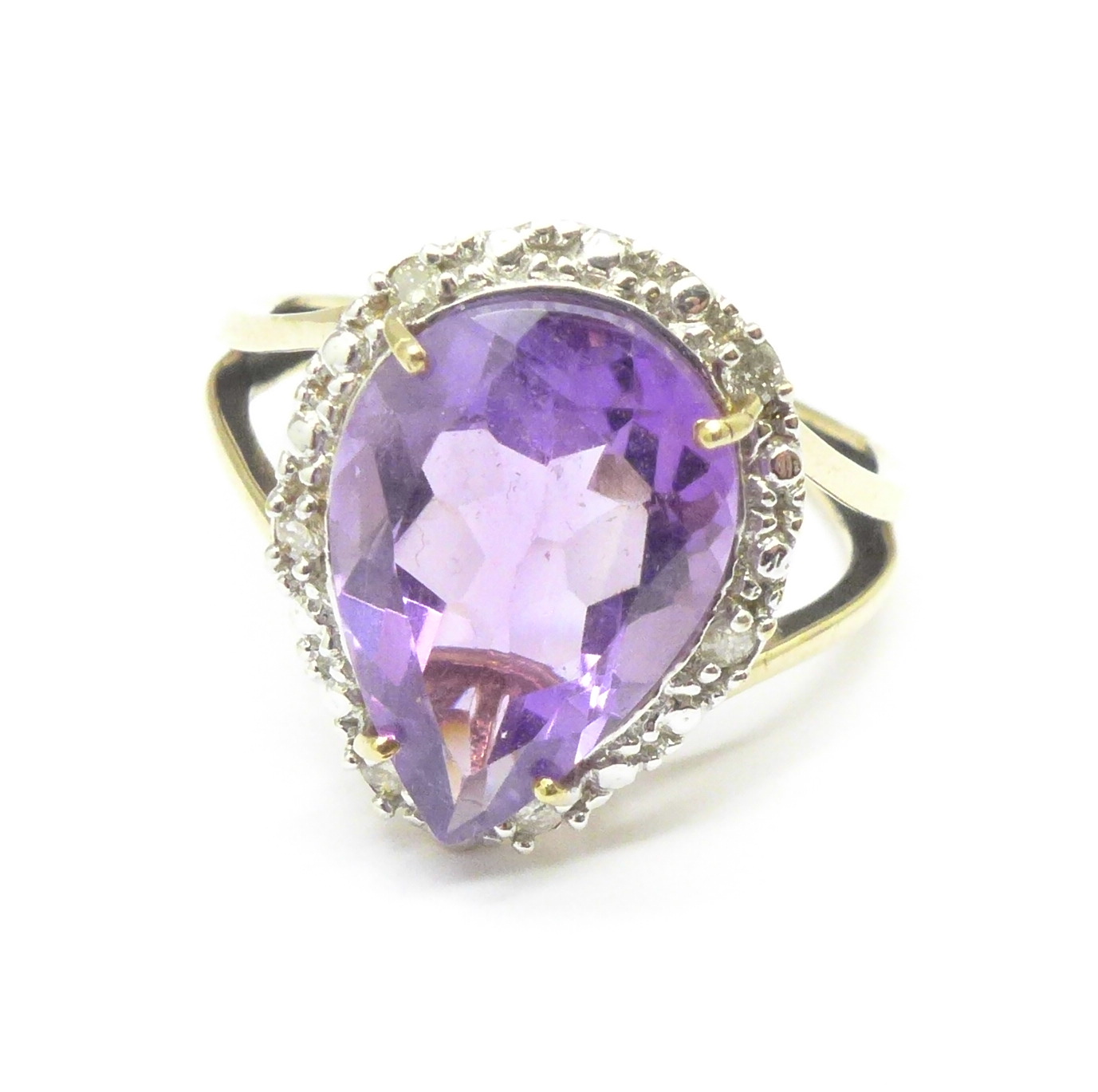 A 9ct gold, pear shaped amethyst and diamond ring, 2.