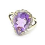A 9ct gold, pear shaped amethyst and diamond ring, 2.