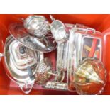 A silver plated candelabra, two serving dishes and covers,
