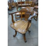 A Victorian oak Captain's chair