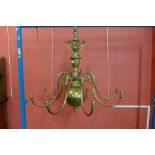 A large Dutch brass eight branch chandelier