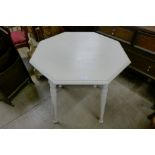 An Arts and Crafts painted octagonal table