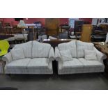 A pair of cream upholstered settees