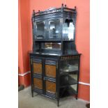 A Victorian Aesthetic Movement ebonised and walnut side cabinet