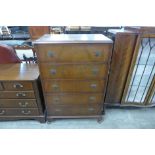 A walnut chest of drawers