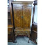 A Queen Anne style walnut cocktail cabinet