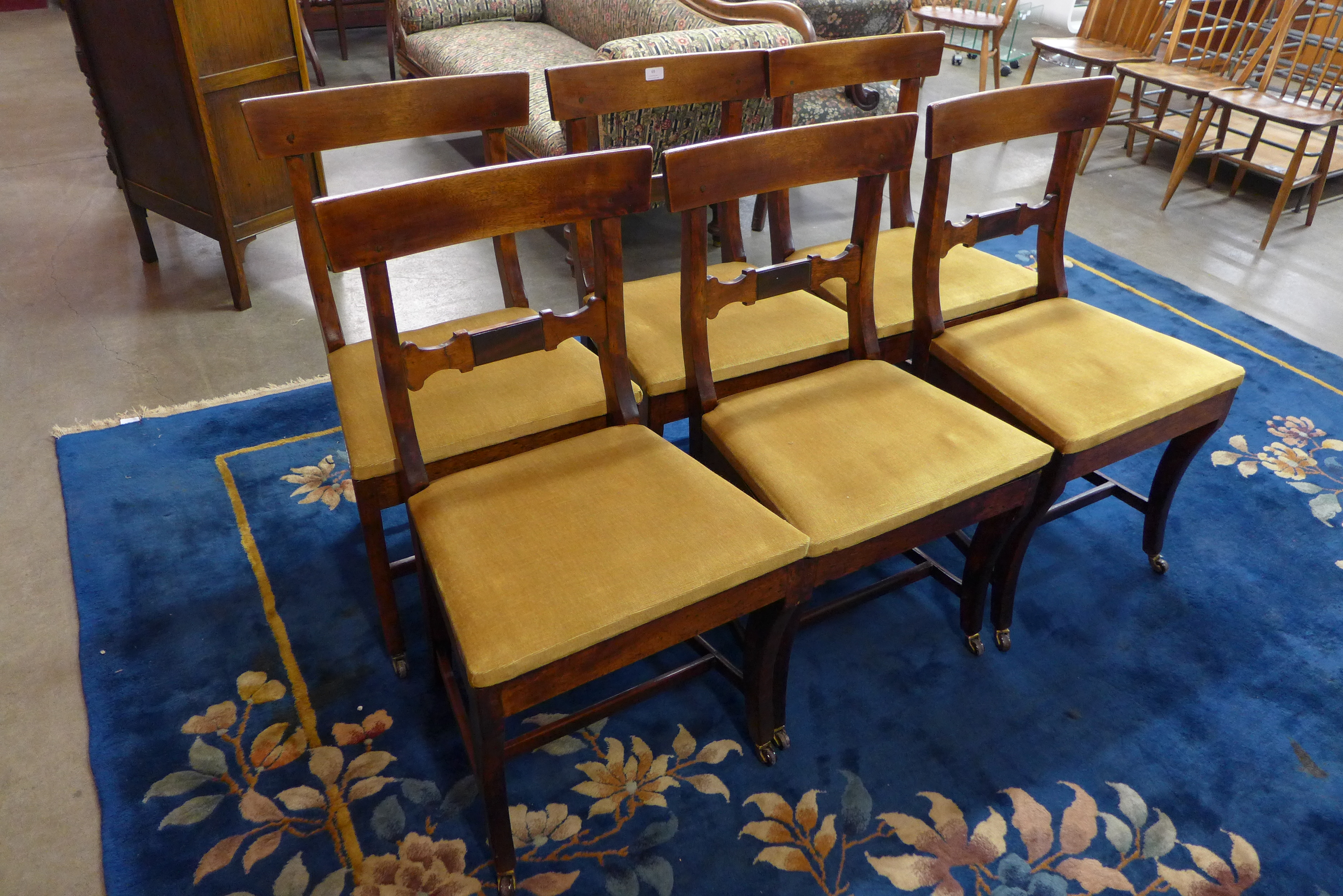 A set of six George III provincial fruitwood dining chairs