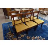 A set of six George III provincial fruitwood dining chairs