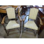 A pair of French elm and upholstered open armchairs