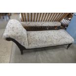 A Victorian beech and upholstered chaise longue
