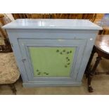 A painted pine single door cupboard