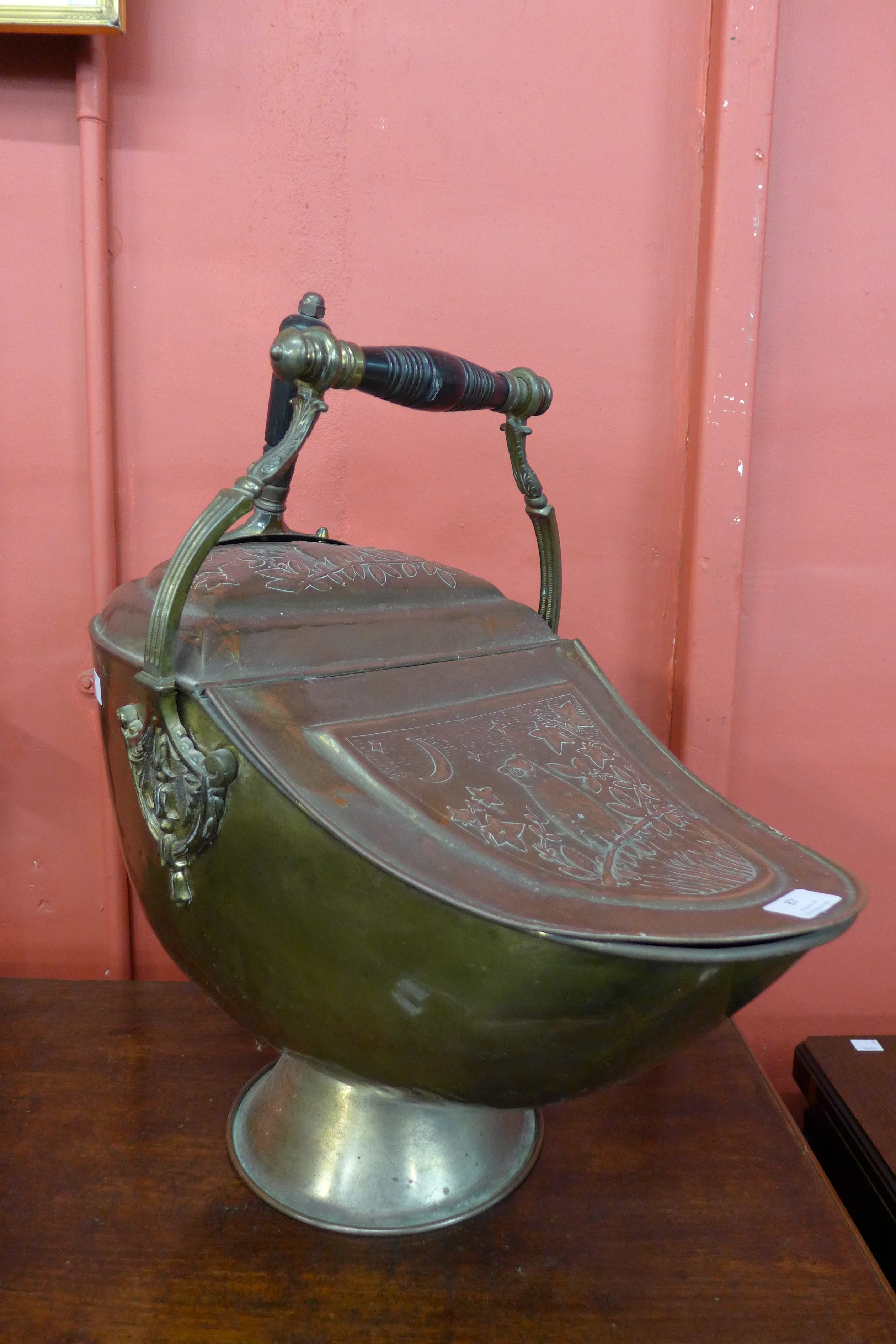 A Victorian Aesthetic Movement brass and copper coal scuttle