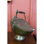 A Victorian Aesthetic Movement brass and copper coal scuttle