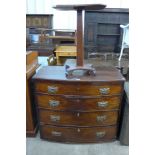 A Victorian mahogany bow front chest of drawers and a mahogany wine table
