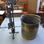 A brass coal bucket and a companion set