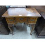 A George III style walnut lowboy