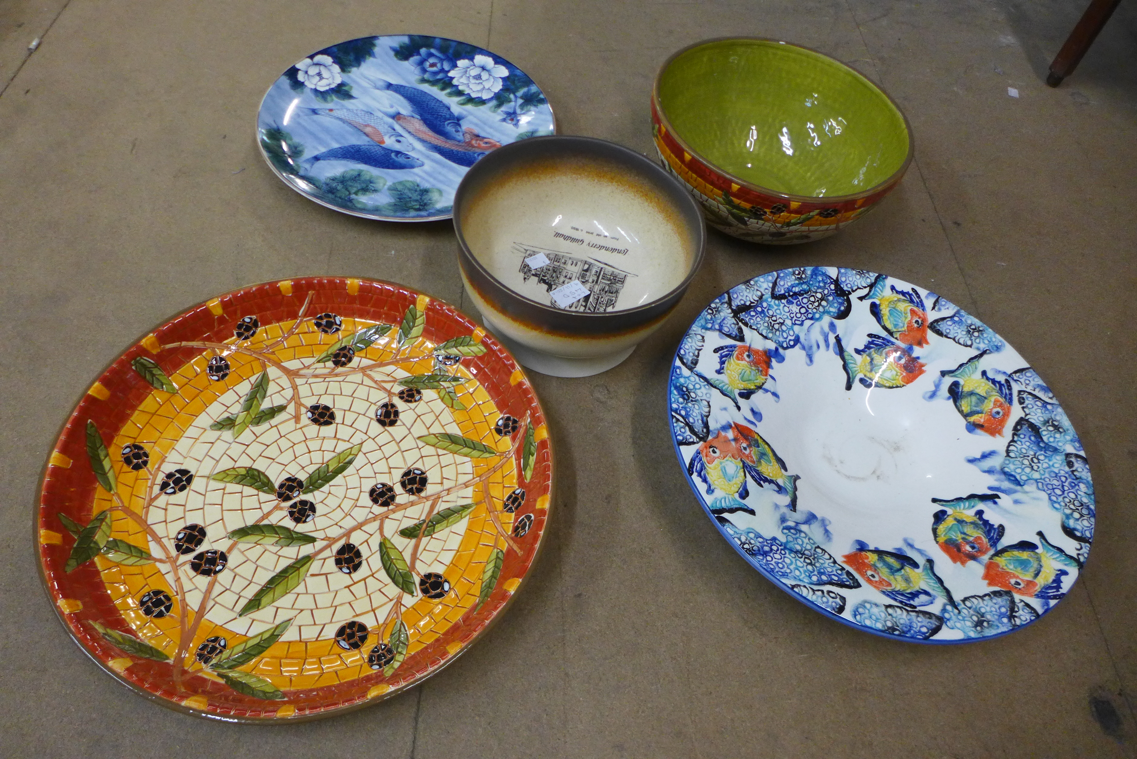 Three porcelain plates and two decorative bowls