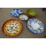 Three porcelain plates and two decorative bowls