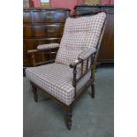 A Victorian elm and upholstered armchair