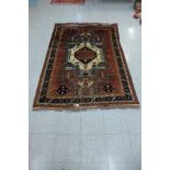 An eastern Caucasian patterned rug - 153cm x 218cm