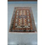 An Afghan patterned rug - 124cm x 183cm