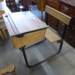 A child's iron and pine school desk and chairs