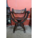 A 19th Century Italian carved walnut folding Savonarola chair