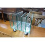 A Green Apple glass magazine rack