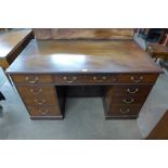 An Edward VII mahogany kneehole desk