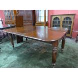 A Victorian mahogany extending dining table