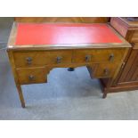 An Edward VII walnut kneehole desk