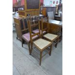 A pair of Arts and Crafts oak bedroom chairs and two others