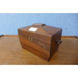 A George III mahogany sarcophagus shaped tea caddy