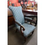 A Victorian mahogany and upholstered armchair