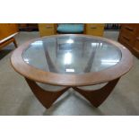 A G-Plan Astro teak and glass topped circular coffee table