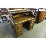 An Edward VII oak tambour roll top desk