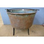A copper cauldron and stand