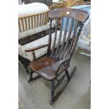 A Victorian beech rocking chair