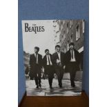 A black and white Beatles print